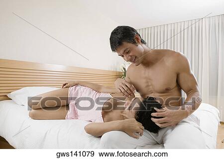 Close-up of a teenage girl lying on a mid adult man's lap View Large Photo Image Stock Photo - Close-up of a teenage girl lying on a mid adult man's lap. Fotosearch