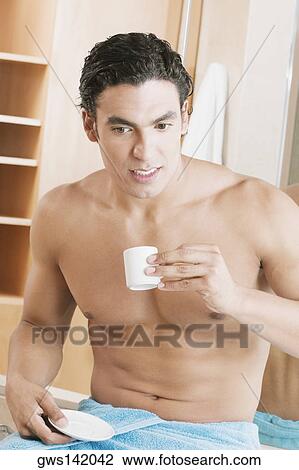 Close-up of a young man drinking a cup of tea View Large Photo Image Stock Image - Close-up of a young man drinking a cup of tea. Fotosearch