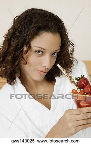Portrait of a teenage girl holding a glass of strawberries View Large Photo Image Stock Photography - Portrait of a teenage girl holding a glass of strawberries. Fotosearch