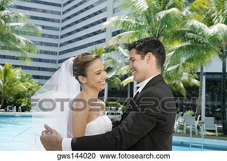Side profile of a newlywed couple facing each other View Large Photo Image Stock Image - Side profile of a newlywed couple facing each other. Fotosearch