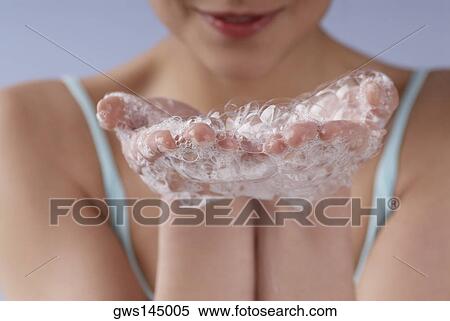 Close-up of a young woman's hand covered with soap suds View Large Photo Image Stock Photography - Close-up of a young woman's hand covered with soap suds. Fotosearch