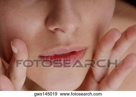 Close-up of a young woman's lips View Large Photo Image Stock Photo - Close-up of a young woman's lips. Fotosearch