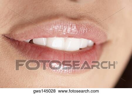 Close-up of a young woman's lips View Large Photo Image Stock Photo - Close-up of a young woman's lips. Fotosearch