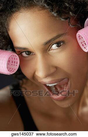 Portrait of a young woman with her mouth open View Large Photo Image Stock Photo - Portrait of a young woman with her mouth open. Fotosearch