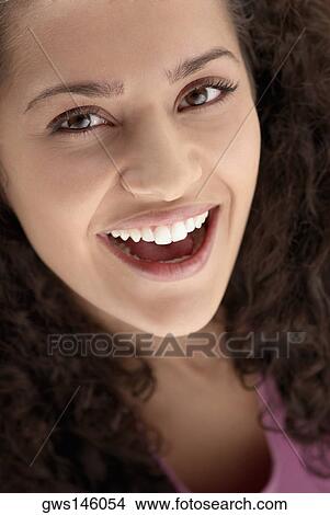 Portrait of a young woman laughing View Large Photo Image Picture - Portrait of a young woman laughing. Fotosearch