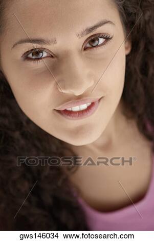 Portrait of a young woman smiling View Large Photo Image Picture - Portrait of a young woman smiling. Fotosearch