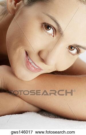 Stock Photo - Portrait of a young woman smiling. Fotosearch