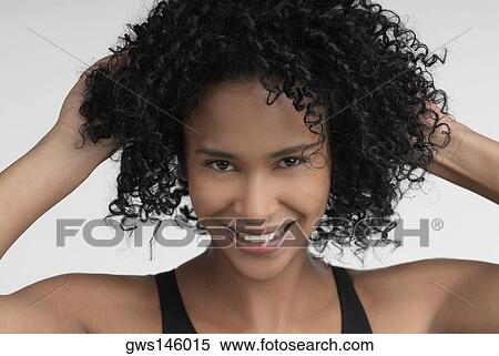 Stock Photography - Portrait of a young woman smiling. Fotosearch