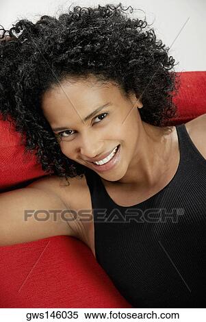 Portrait of a young woman smiling View Large Photo Image Stock Photography - Portrait of a young woman smiling. Fotosearch