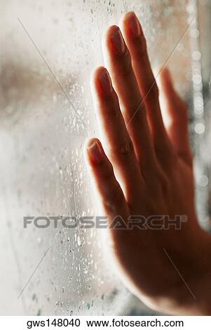 Close-up of a human hand on a glass window View Large Photo Image Stock Image - Close-up of a human hand on a glass window. Fotosearch
