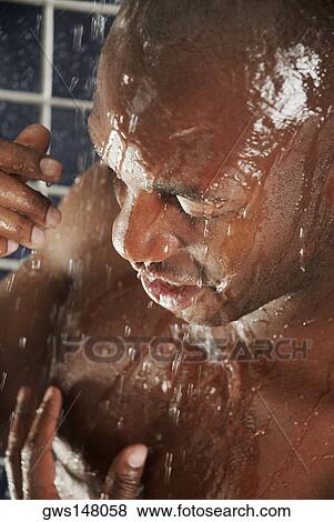 Close-up of a young man having a bath View Large Photo Image Stock Photo - Close-up of a young man having a bath. Fotosearch