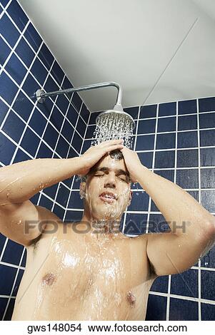 Close-up of a young man in the shower View Large Photo Image Picture - Close-up of a young man in the shower. Fotosearch