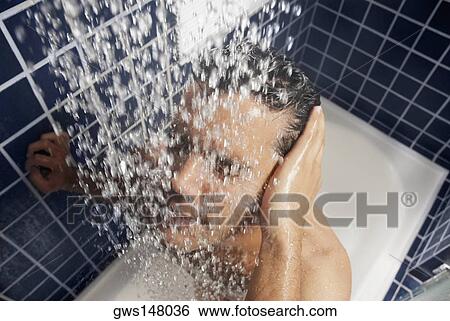Stock Photograph - Close-up of a young man in the shower. Fotosearch