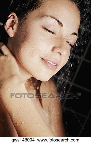 Close-up of a young woman in the shower View Large Photo Image Picture - Close-up of a young woman in the shower. Fotosearch