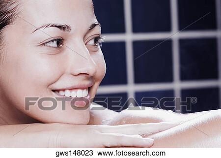Close-up of a young woman in the bathroom View Large Photo Image Stock Image - Close-up of a young woman in the bathroom. Fotosearch