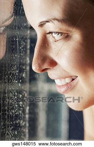 Stock Photography - Close-up of a young woman smiling. Fotosearch