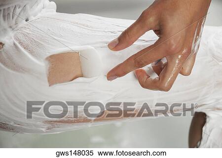 Low section view of a woman applying shaving cream on her leg View Large Photo Image Stock Photography - Low section view of a woman applying shaving cream on her leg. Fotosearch