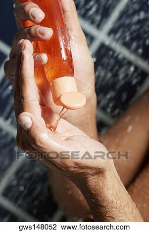 Man pouring soap on the palm of his hand View Large Photo Image Stock Image - Man pouring soap on the palm of his hand. Fotosearch