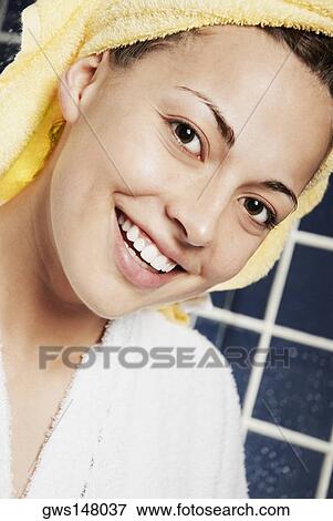 Portrait of a young woman smiling View Large Photo Image Stock Photo - Portrait of a young woman smiling. Fotosearch