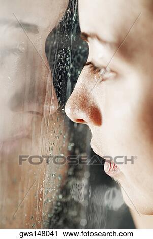 Reflection of a young woman on a glass surface View Large Photo Image Stock Image - Reflection of a young woman on a glass surface. Fotosearch