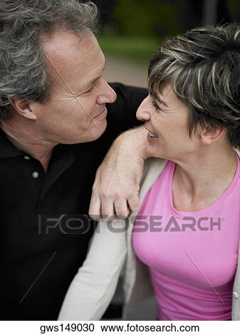 Close-up of a mature couple face to face and smiling View Large Photo Image Stock Image - Close-up of a mature couple face to face and smiling. Fotosearch