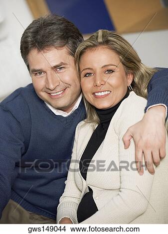Portrait of a mature man and a mid adult woman smiling together View Large Photo Image Picture - Portrait of a mature man and a mid adult woman smiling together. Fotosearch