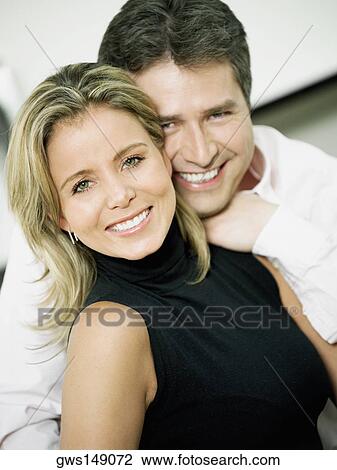 Portrait of a mid adult woman and a mature man smiling View Large Photo Image Stock Image - Portrait of a mid adult woman and a mature man smiling. Fotosearch