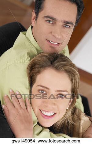 Portrait of a young couple smiling View Large Photo Image Picture - Portrait of a young couple smiling. Fotosearch