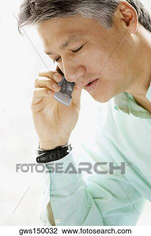 Close-up of a senior man talking on a mobile phone View Large Photo Image Stock Image - Close-up of a senior man talking on a mobile phone. Fotosearch
