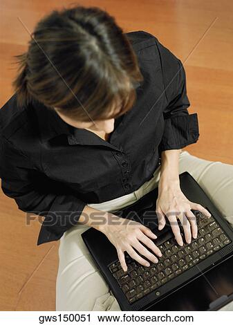 High angle view of a businesswoman using a laptop View Large Photo Image Stock Image - High angle view of a businesswoman using a laptop. Fotosearch