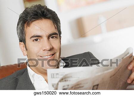 Portrait of a mature man reading a newspaper View Large Photo Image Stock Image - Portrait of a mature man reading a newspaper. Fotosearch
