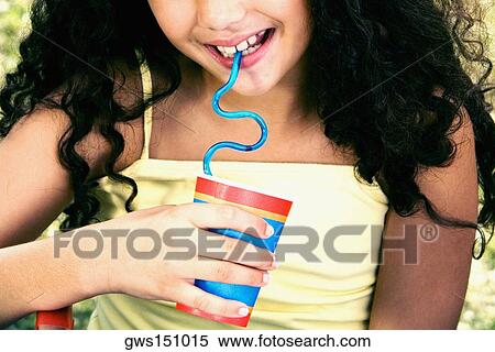 Close-up of a girl holding a disposable cup and drinking with a straw View Large Photo Image Stock Photography - Close-up of a girl holding a disposable cup and drinking with a straw. Fotosearch