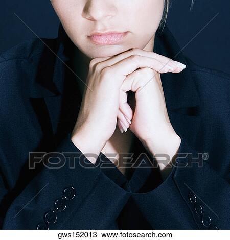 Close-up of a businesswoman thinking with her hand under her chin View Large Photo Image Stock Image - Close-up of a businesswoman thinking with her hand under her chin. Fotosearch