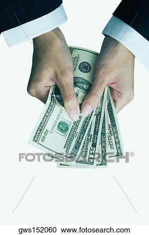 High angle view of a businesswoman's hand holding dollar bills View Large Photo Image Stock Image - High angle view of a businesswoman's hand holding dollar bills. Fotosearch