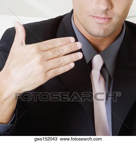 Mid section view of a businessman gesturing with his hand View Large Photo Image Stock Image - Mid section view of a businessman gesturing with his hand. Fotosearch