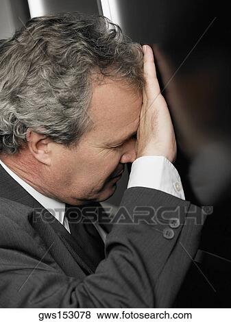 Close-up of a businessman looking stressed View Large Photo Image Stock Photo - Close-up of a businessman looking stressed. Fotosearch