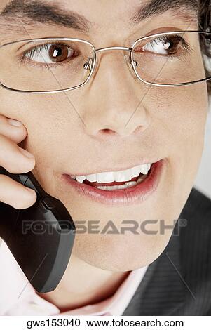 Close-up of a businessman using a mobile phone View Large Photo Image Stock Image - Close-up of a businessman using a mobile phone. Fotosearch