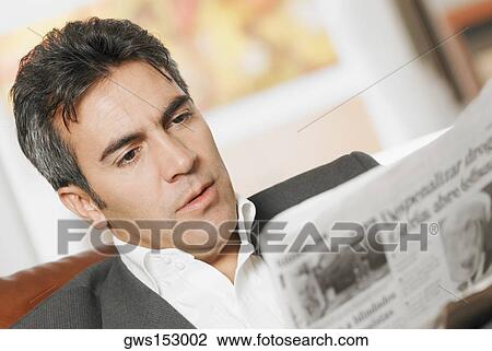 Close-up of a mature man reading a newspaper View Large Photo Image Stock Image - Close-up of a mature man reading a newspaper. Fotosearch