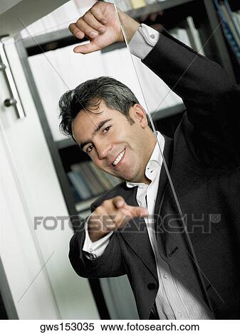 Portrait of a businessman leaning against a glass door View Large Photo Image Stock Photography - Portrait of a businessman leaning against a glass door. Fotosearch