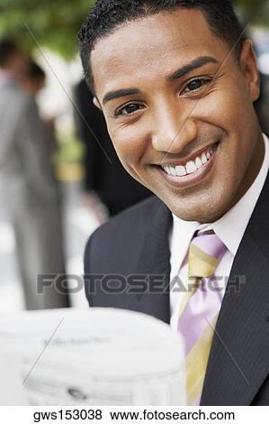 Portrait of a businessman smiling View Large Photo Image Stock Photo - Portrait of a businessman smiling. Fotosearch