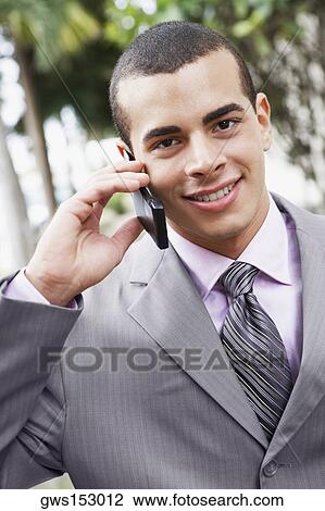 Portrait of a businessman talking on a mobile phone View Large Photo Image Stock Image - Portrait of a businessman talking on a mobile phone. Fotosearch