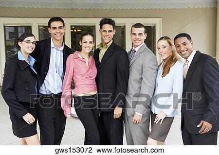 Stock Image - Portrait of a group of business executives standing. Fotosearch