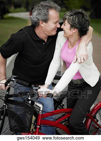 Mature couple looking at each other and smiling View Large Photo Image Stock Photo - Mature couple looking at each other and smiling. Fotosearch