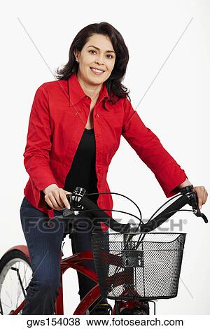 Portrait of a mid adult woman on a bicycle View Large Photo Image Stock Photo - Portrait of a mid adult woman on a bicycle. Fotosearch