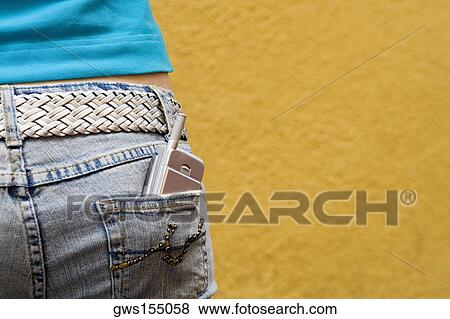 Close-up of a mobile phone in a teenage girl's back pocket View Large Photo Image Stock Photo - Close-up of a mobile phone in a teenage girl's back pocket. Fotosearch