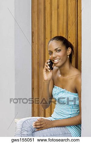 Close-up of a teenage girl talking on a mobile phone View Large Photo Image Stock Image - Close-up of a teenage girl talking on a mobile phone. Fotosearch