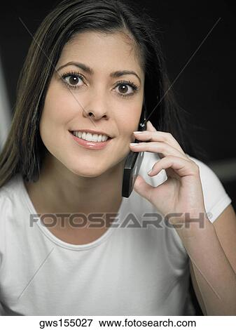 Portrait of a mid adult woman using a mobile phone View Large Photo Image Stock Photo - Portrait of a mid adult woman using a mobile phone. Fotosearch
