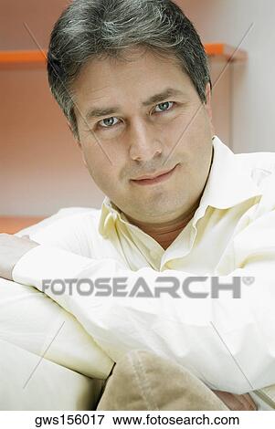 Close-up of a mature man thinking View Large Photo Image Stock Photo - Close-up of a mature man thinking. Fotosearch