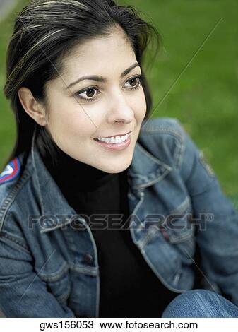 Close-up of a mid adult woman looking away View Large Photo Image Stock Image - Close-up of a mid adult woman looking away. Fotosearch