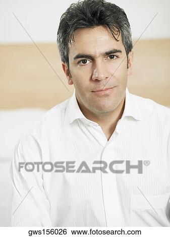 Portrait of a businessman smirking View Large Photo Image Stock Photograph - Portrait of a businessman smirking. Fotosearch